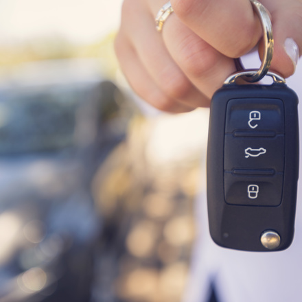 Person holding a car key