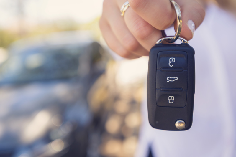 Person holding a car key