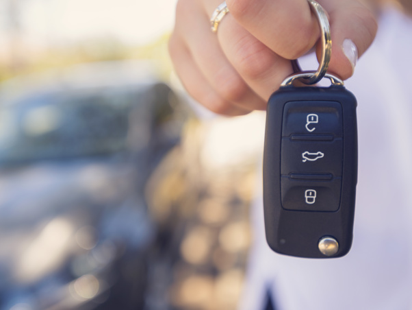 Person holding a car key