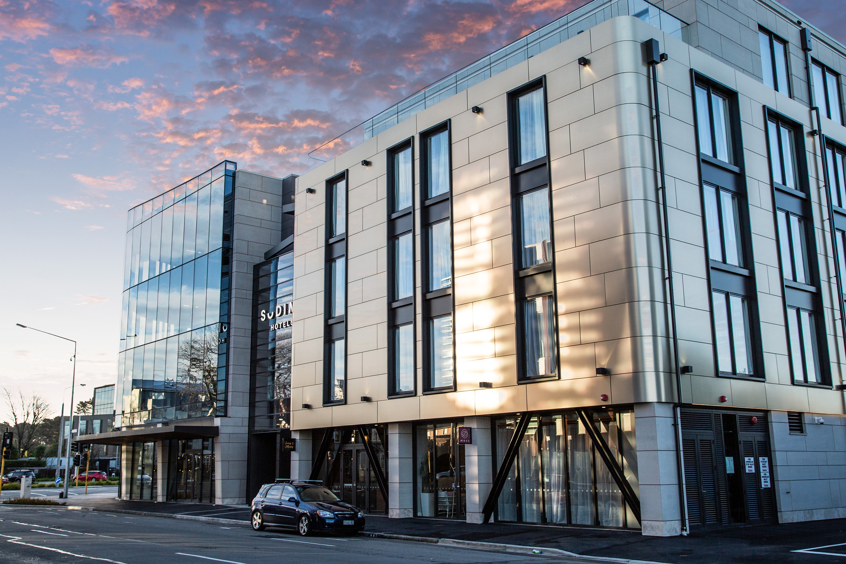 Exterior shot of Sudima Christchurch City building at dusk.