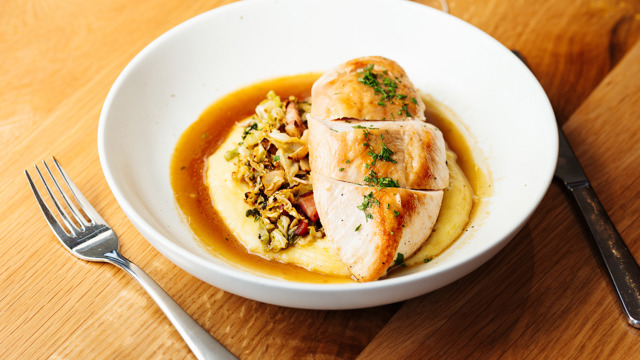 Baked chicken on mash and sauce